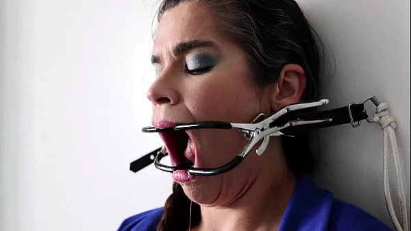 Extreme gag predicament - nailed to the wall