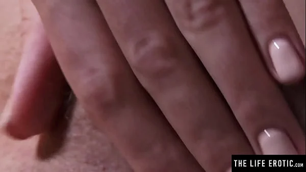 Watch this cute brunette soap up her hairy pussy in the shower